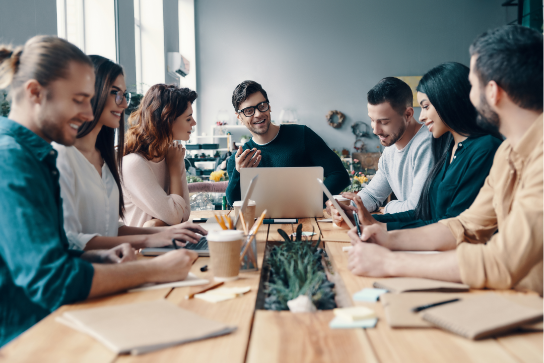 Team of marketers using AI tools on multiple devices with data charts and SEO metrics floating around them